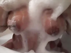 Playing with my breast in a bubble bath (tease)