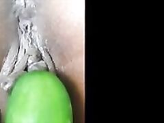 Kinky Indian slut gets fucked with a cucumber.