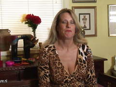 Hot American cougar mom masturbates while talking on phone