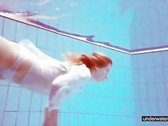 Cute Melissa plays underwater