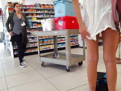 Candid voyeur blonde in see-thru shows thong ass