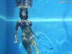 Pornstar Heidi Van Horny swims naked in the pool