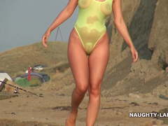 Sheer swimsuit and nude on the beach