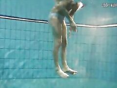 Hot babe swims in the sea like a mermaid