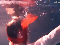 Bulava Lozhkova with a red tie and skirt underwater