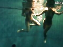 Girls Andrea and Monica stripping one another underwater
