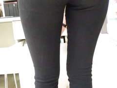 Sexy big ass of a saleswoman in tight jeans in an office
